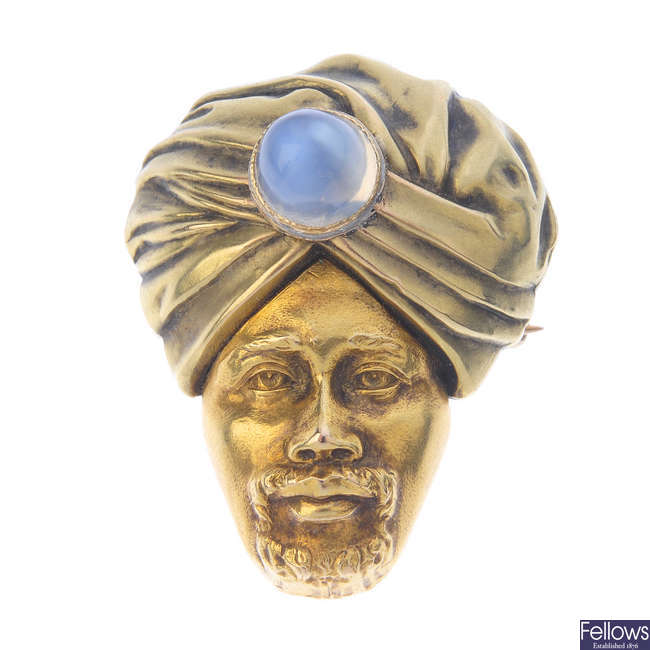 An early 20th century gold moonstone brooch.