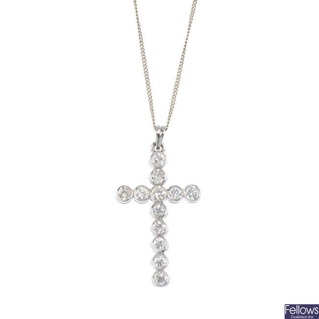 A diamond cross pendant, with chain. 
