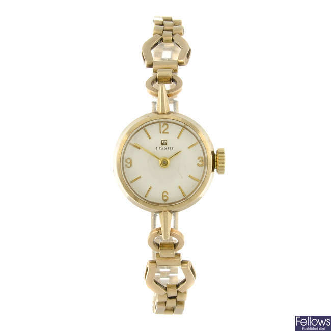 TISSOT - a lady's 9ct yellow gold bracelet watch.