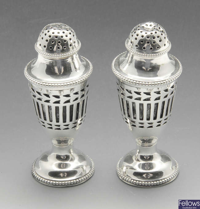 A pair of George III silver peppers.