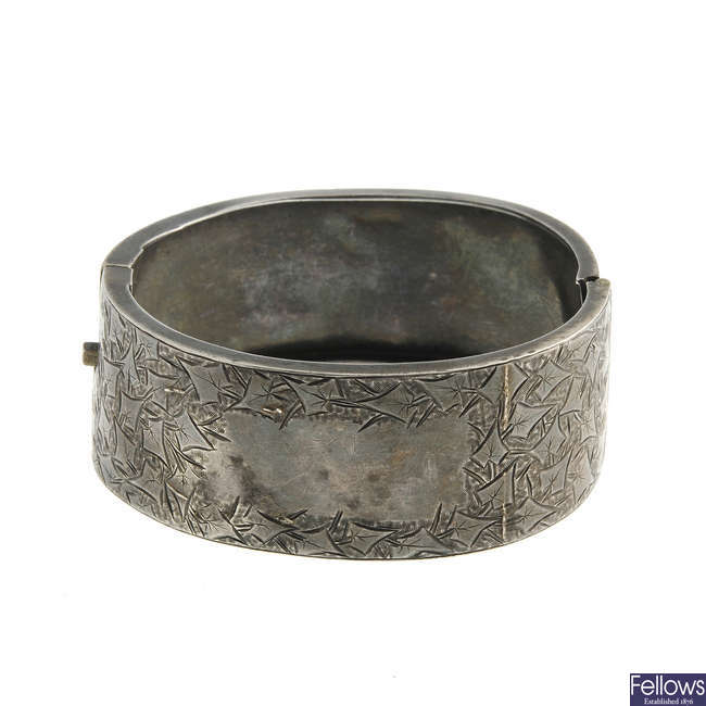 A late 19th century silver hinged bangle.