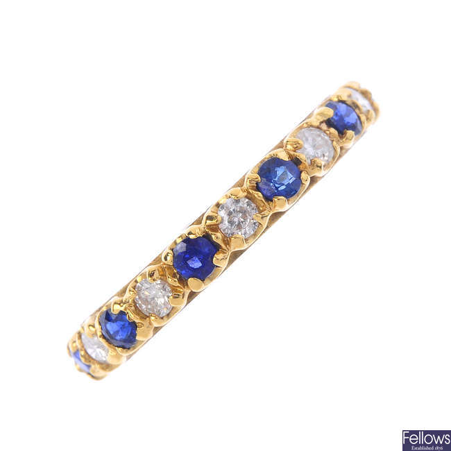 An 18ct gold sapphire and diamond full-circle eternity ring.