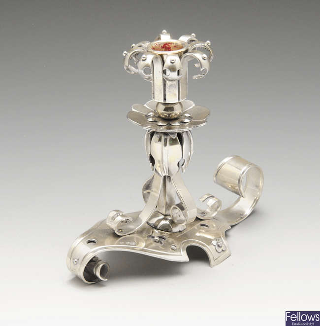 A turn of the century chamberstick or candlestick of Arts & Crafts style.