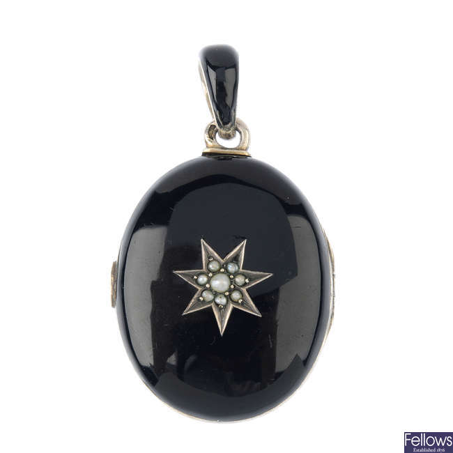 A late 19th century black enamel and split pearl locket.