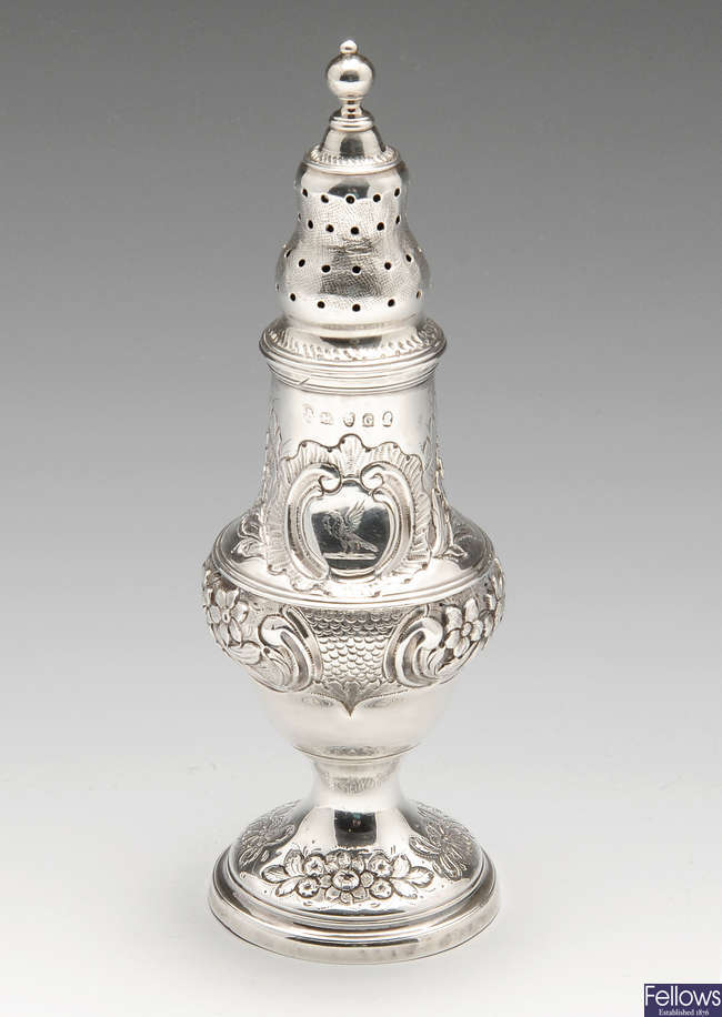 A George III silver caster.
