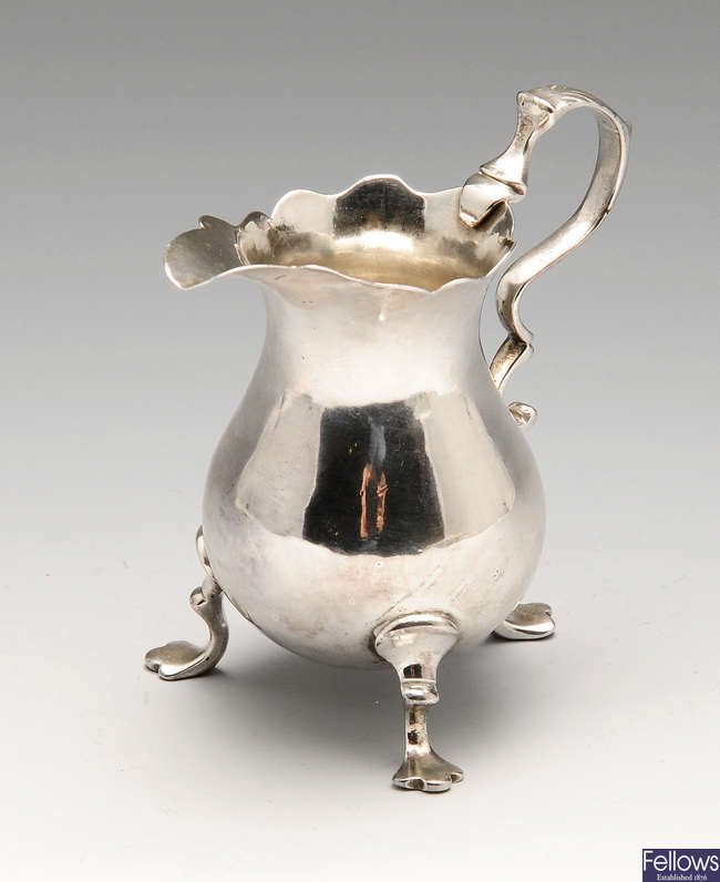 A George II small silver cream jug.