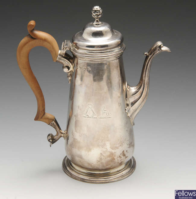 A George II silver coffee pot.