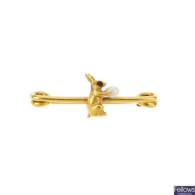 An early 20th century 9ct gold seed pearl rabbit bar brooch.