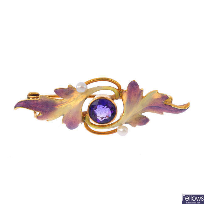 An Art Nouveau 14ct gold amethyst, seed pearl and enamel brooch.