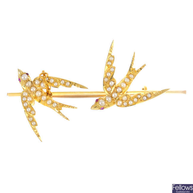 An early 20th century seed pearl swallow bar brooch.
