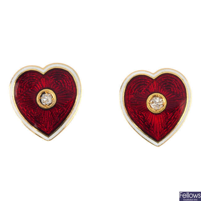 A pair of diamond and enamel heart earrings.