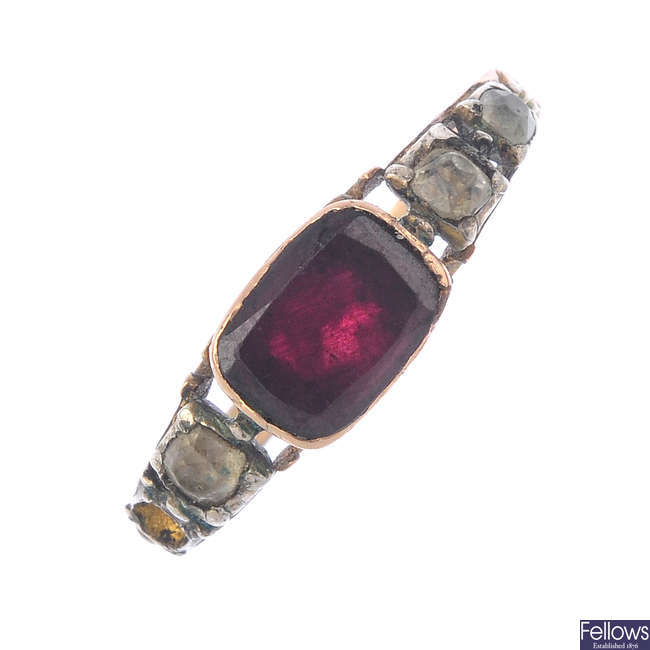 A late Georgian gold garnet and paste ring.