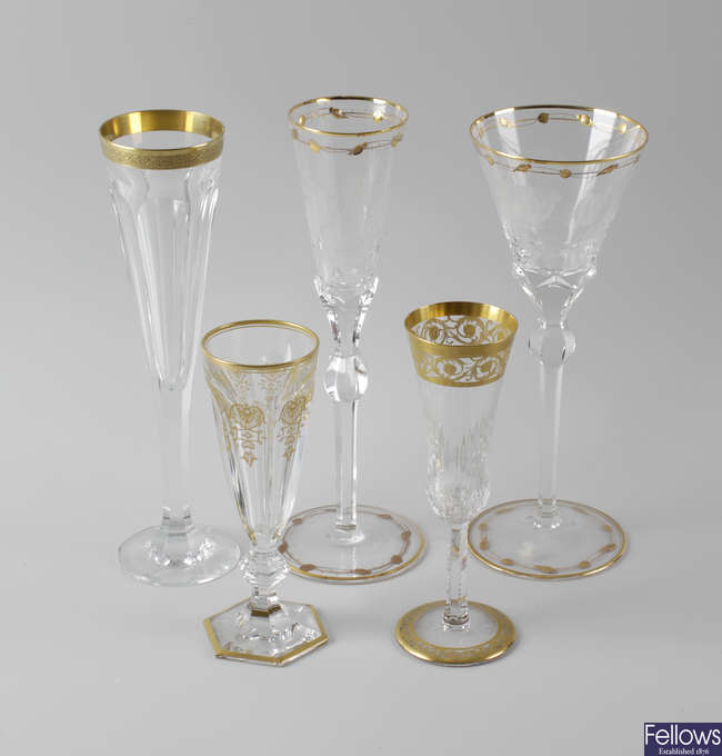 Five pairs of gilt-enriched champagne and wine glasses