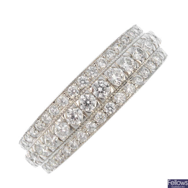 A diamond three-row dress ring.