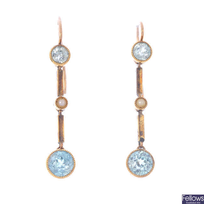 A pair of zircon and split pearl earrings.