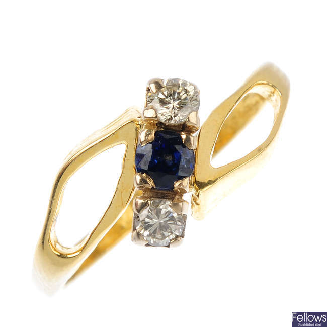 An 18ct gold diamond and sapphire three-stone ring.