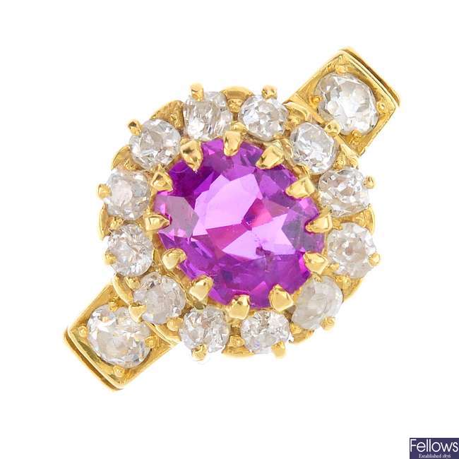 A late Victorian 18ct gold ruby and diamond cluster ring.