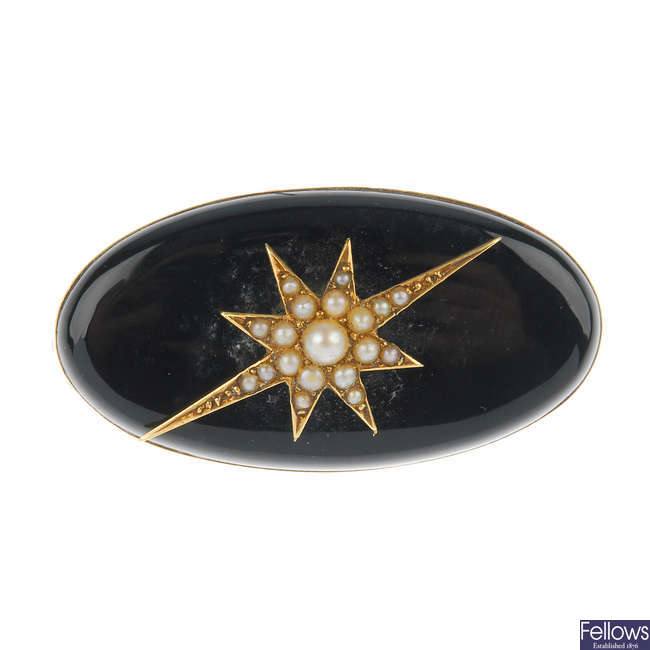 A late Victorian onyx and split pearl memorial brooch.