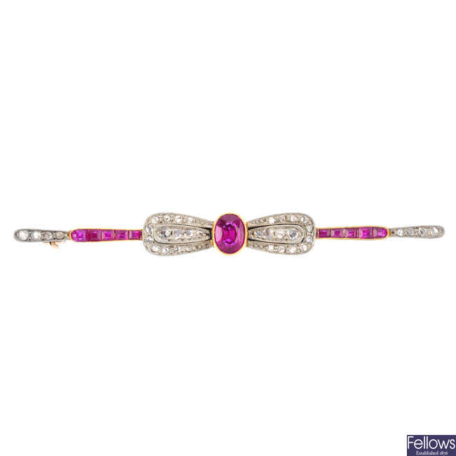 An early 20th century gold synthetic ruby and diamond bow brooch.