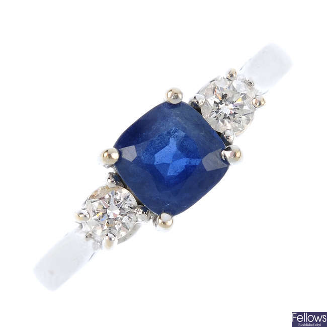 An 18ct gold sapphire and diamond three-stone ring. 