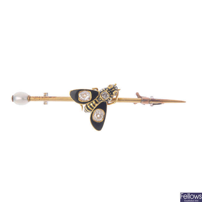 A late Victorian gold, enamel and seed pearl bee brooch.