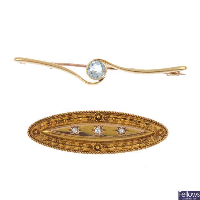 A late Victorian 15ct gold diamond brooch and a later 15ct gold aquamarine brooch.