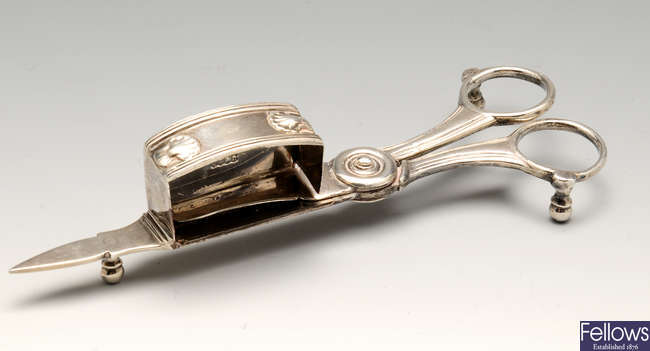 A pair of late George III Irish silver candle snuffers.