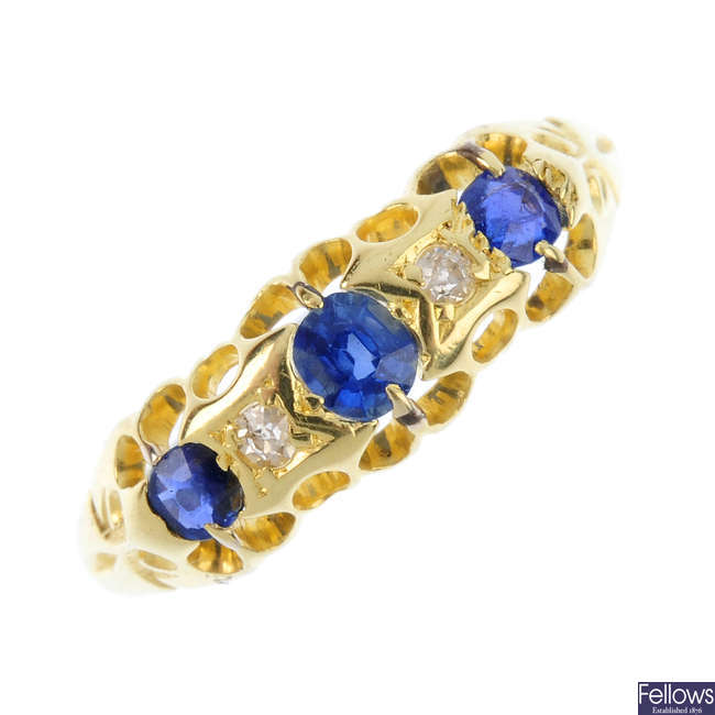 An early 20th century 18ct gold sapphire, diamond and garnet-topped-doublet five-stone ring.