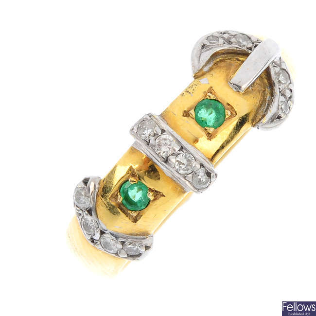 A diamond and emerald buckle ring.