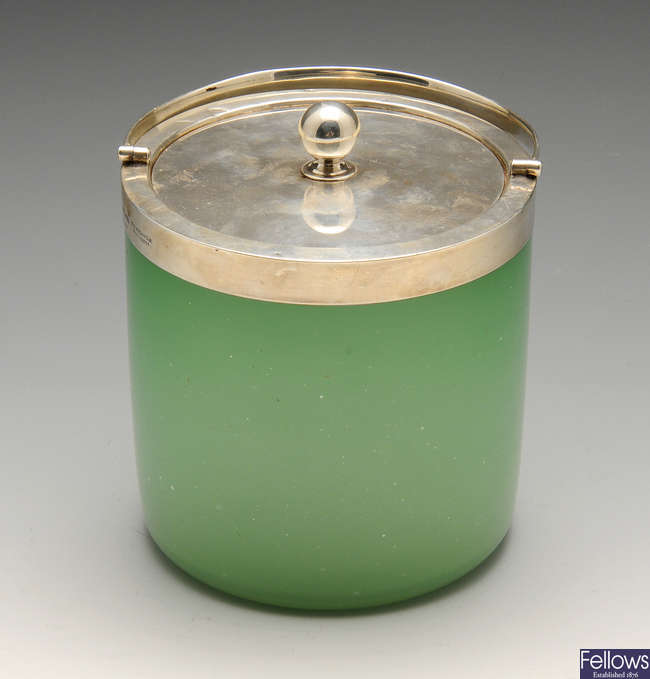 An early twentieth century silver mounted green-glass biscuit barrel.