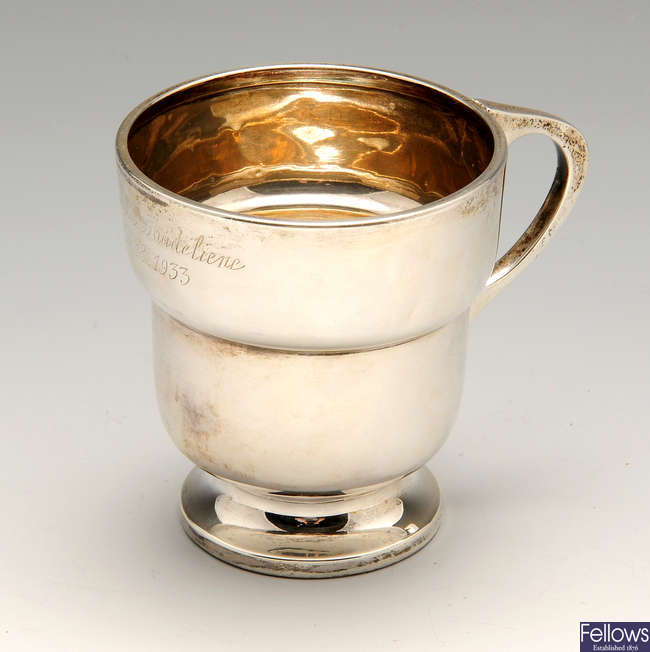 An Art Deco silver christening mug, plus a 1920's smaller example.