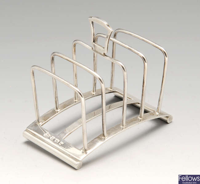 An Art Deco silver four-divide toast rack.