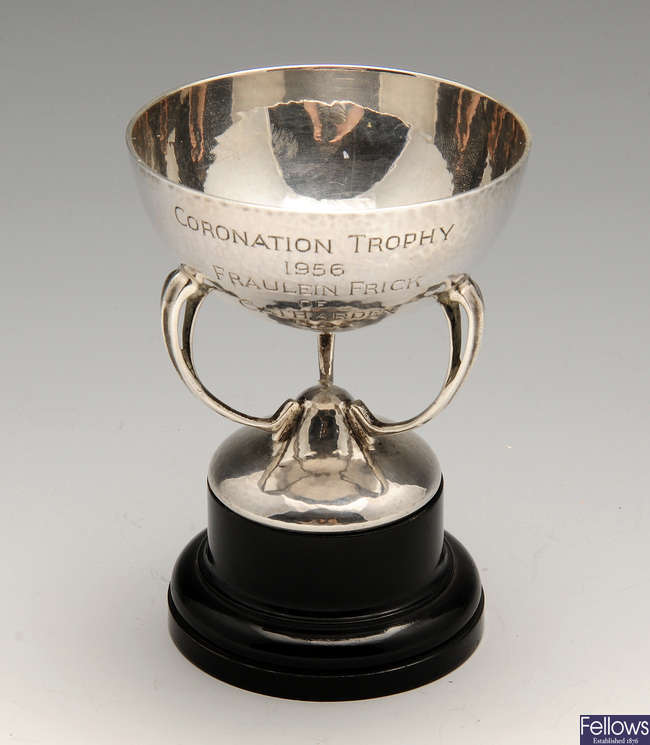 A small silver trophy cup of Art Nouveau style.