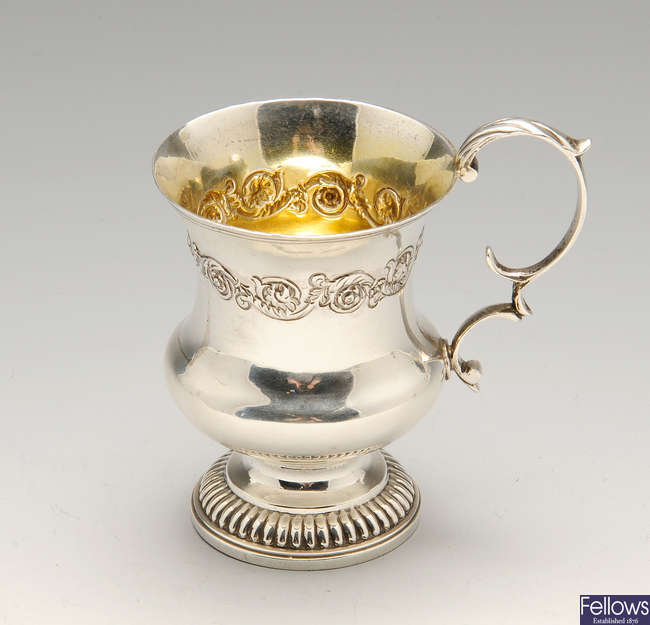 A George IV silver christening mug and a silver embossed bowl.