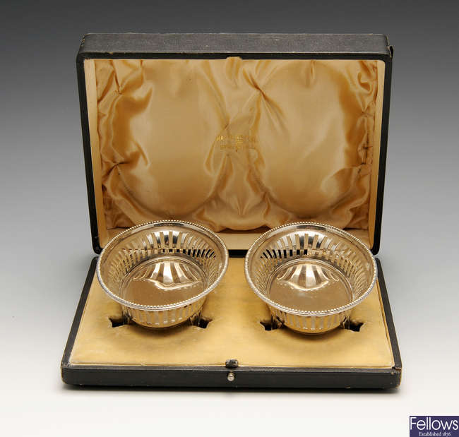 A cased pair of early 20th century silver bonbon dishes of oval form.