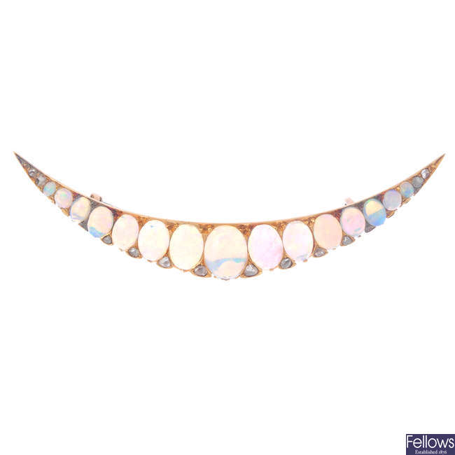 A late Victorian gold opal and diamond crescent brooch, circa 1870.