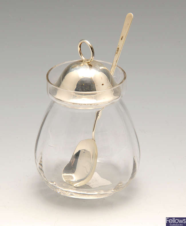 An early twentieth century silver lidded glass preserve jar & 1920's caster.