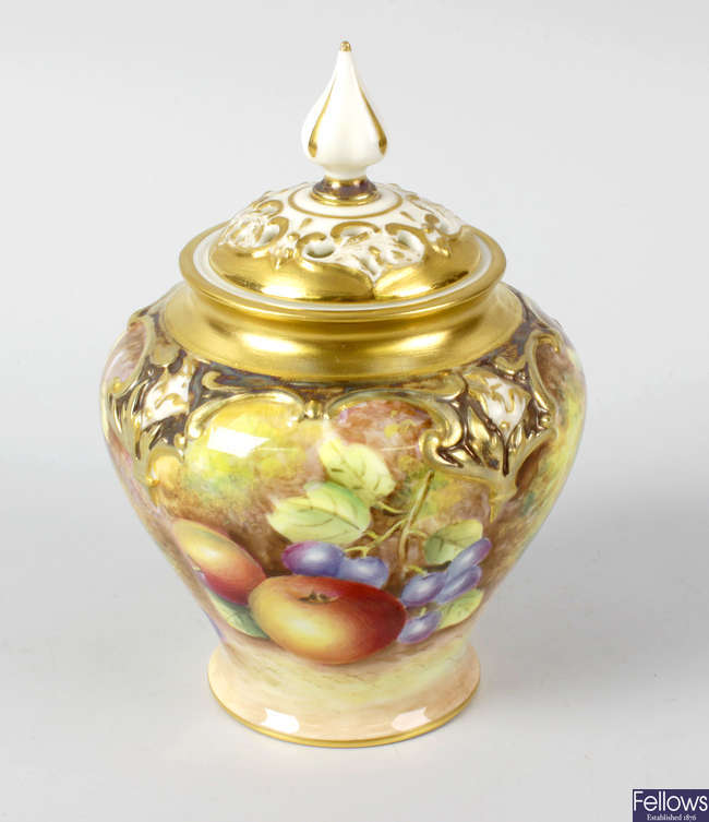 A small Royal Worcester porcelain fruit-painted pot pourri vase and cover by Leaman