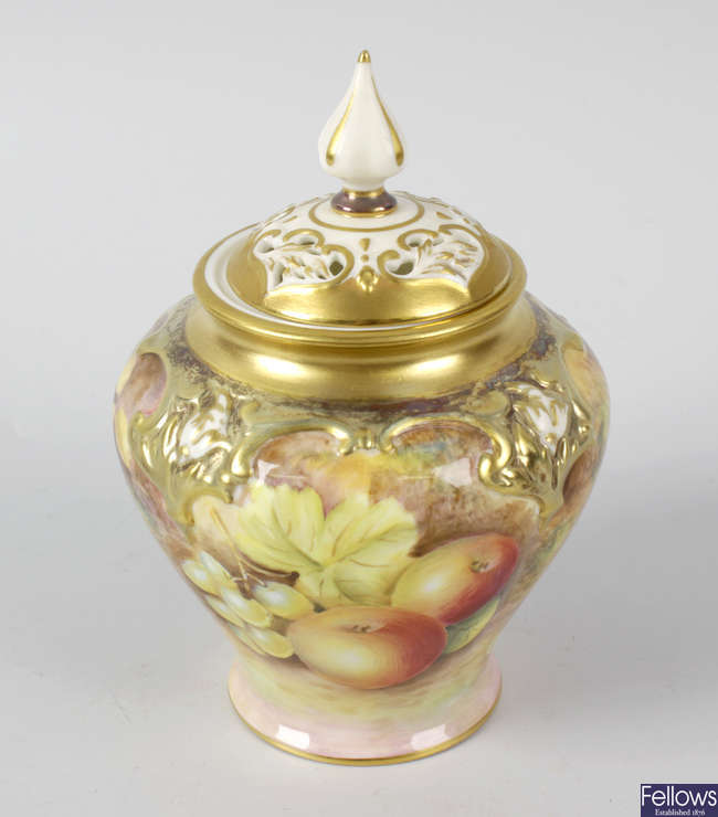 A small Royal Worcester porcelain fruit-painted pot pourri vase and cover by Leaman