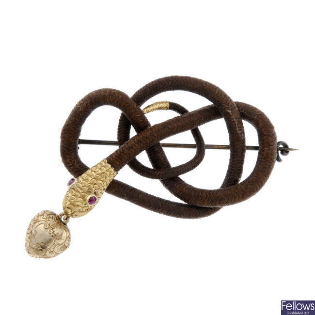 An early to mid Victorian memorial snake gold hair brooch.