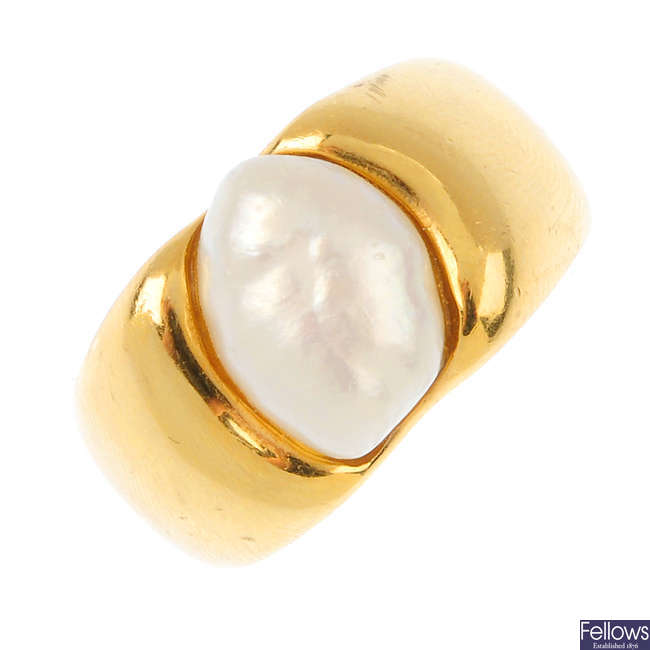 A cultured pearl dress ring.
