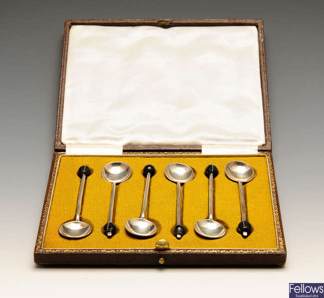 A 1920's cased set of six silver coffee spoons, etc.