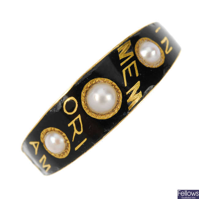 A late Victorian gold enamel and split pearl memoriam ring.