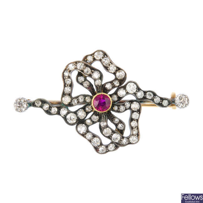 An early 20th century silver and gold diamond and ruby brooch.