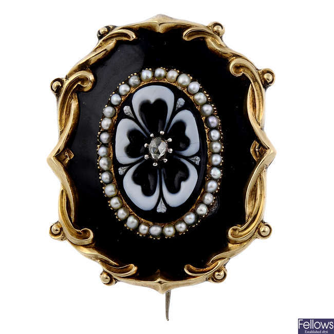 A early Victorian onyx, split pearl, diamond and enamel mourning brooch.
