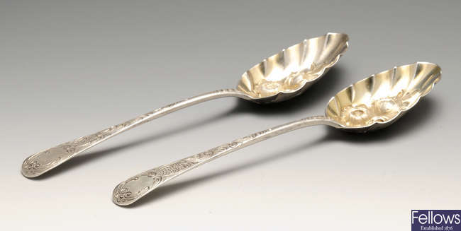 A selection of silver to include a pair of George III silver berry spoons, four silver George IV Fiddle pattern teaspoons, etc.