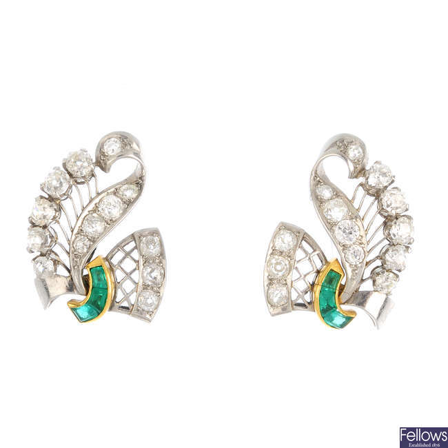 A pair of 1950s emerald and diamond earrings.