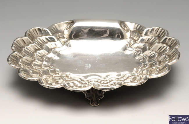 An Edwardian silver shell dish & a later circular dish. (2).