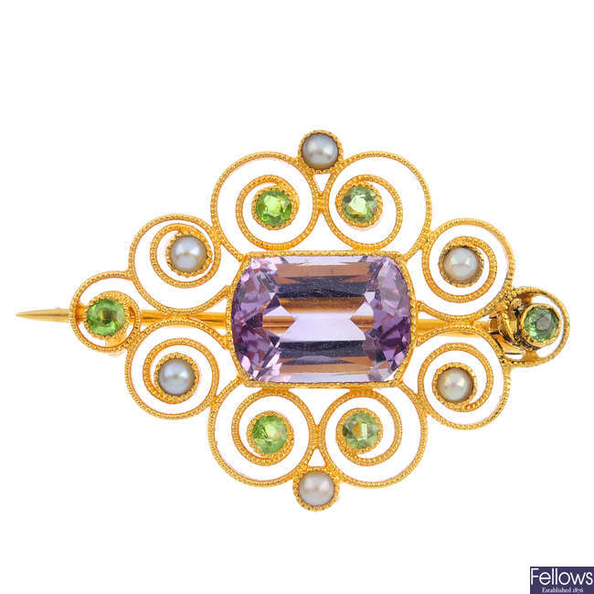 An early 20th century 15ct gold gem-set brooch.
