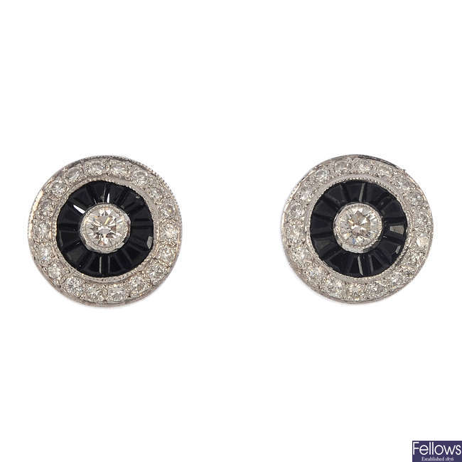 A pair of 18ct gold onyx and diamond earrings.